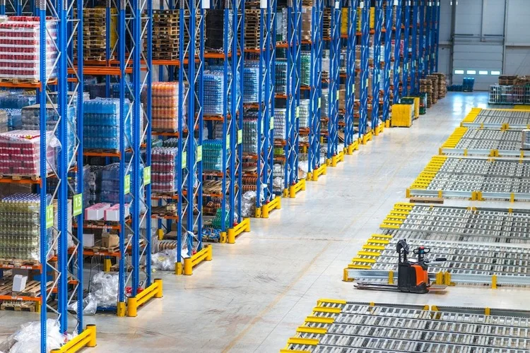 Interior of a large distribution warehouse with stocked shelving